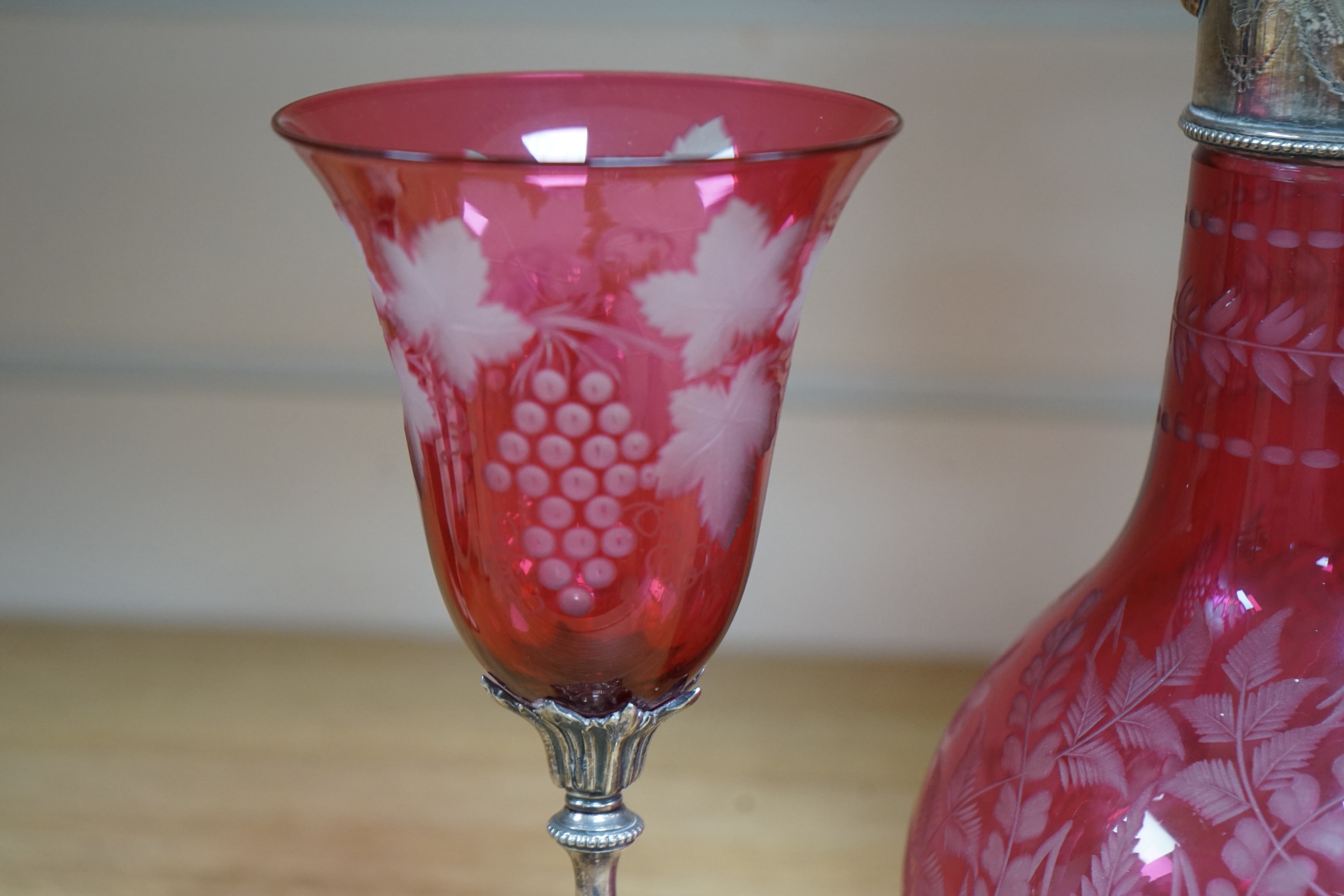 A Victorian electroplate mounted cranberry glass claret jug and a similar goblet by Elkington & Co. 26cm. Condition - good